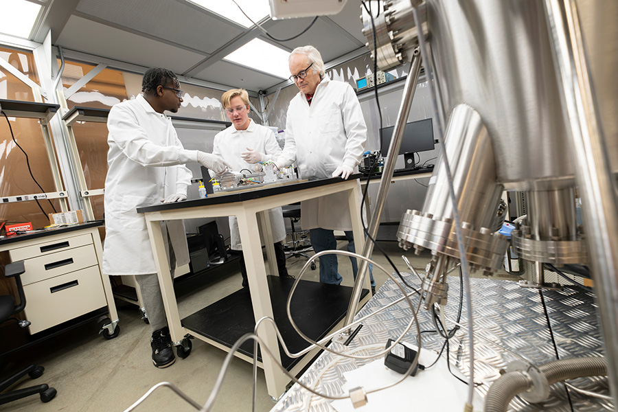 Dr. Tony Cofer working on the FEMTA thruster with students